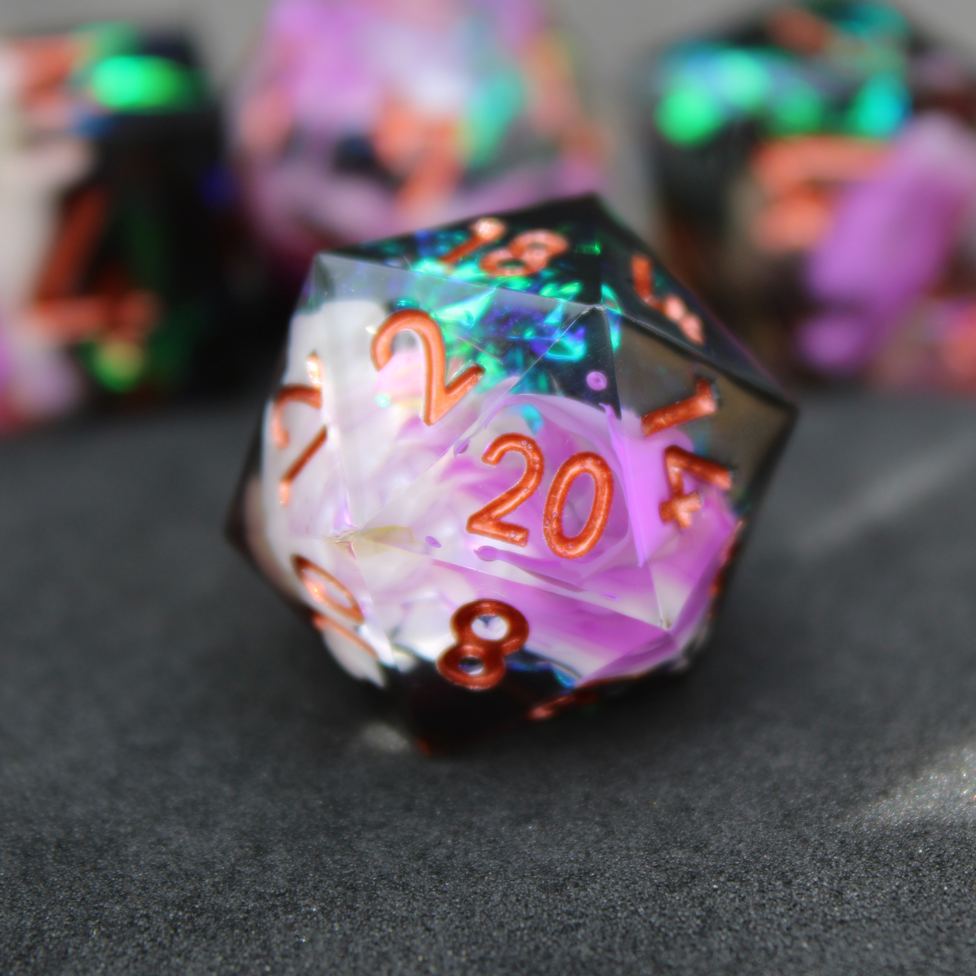 Purple and black resin dnd sharp edge dice. These polyhedral dice are used to play TTRPGs like Dungeons & Dragons / D&D and Pathfinder.