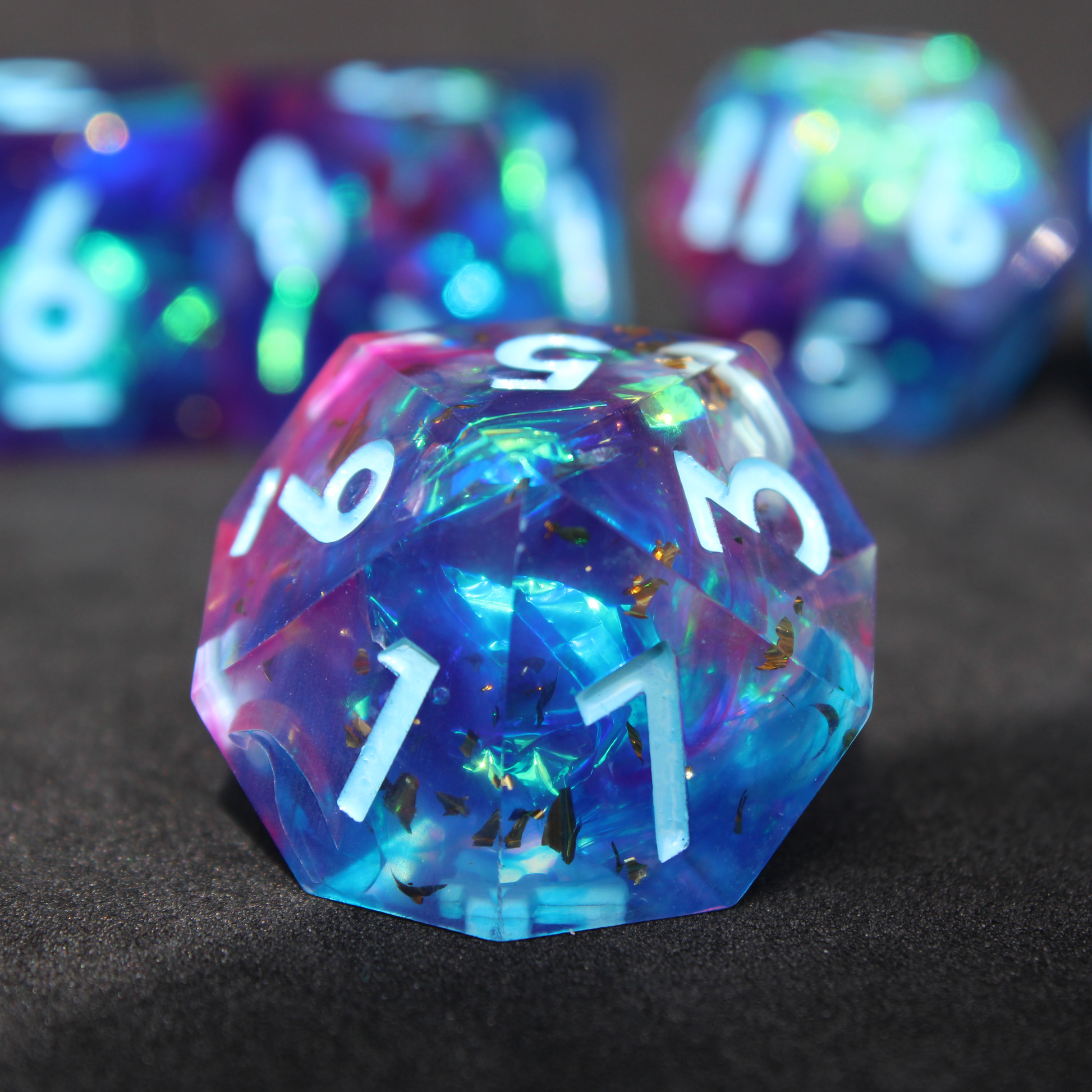 Purple and blue sharp edge dnd dice set. The dice set is used for playing TTRPGs like Dungeons & Dragons / D&D and Pathfinder.