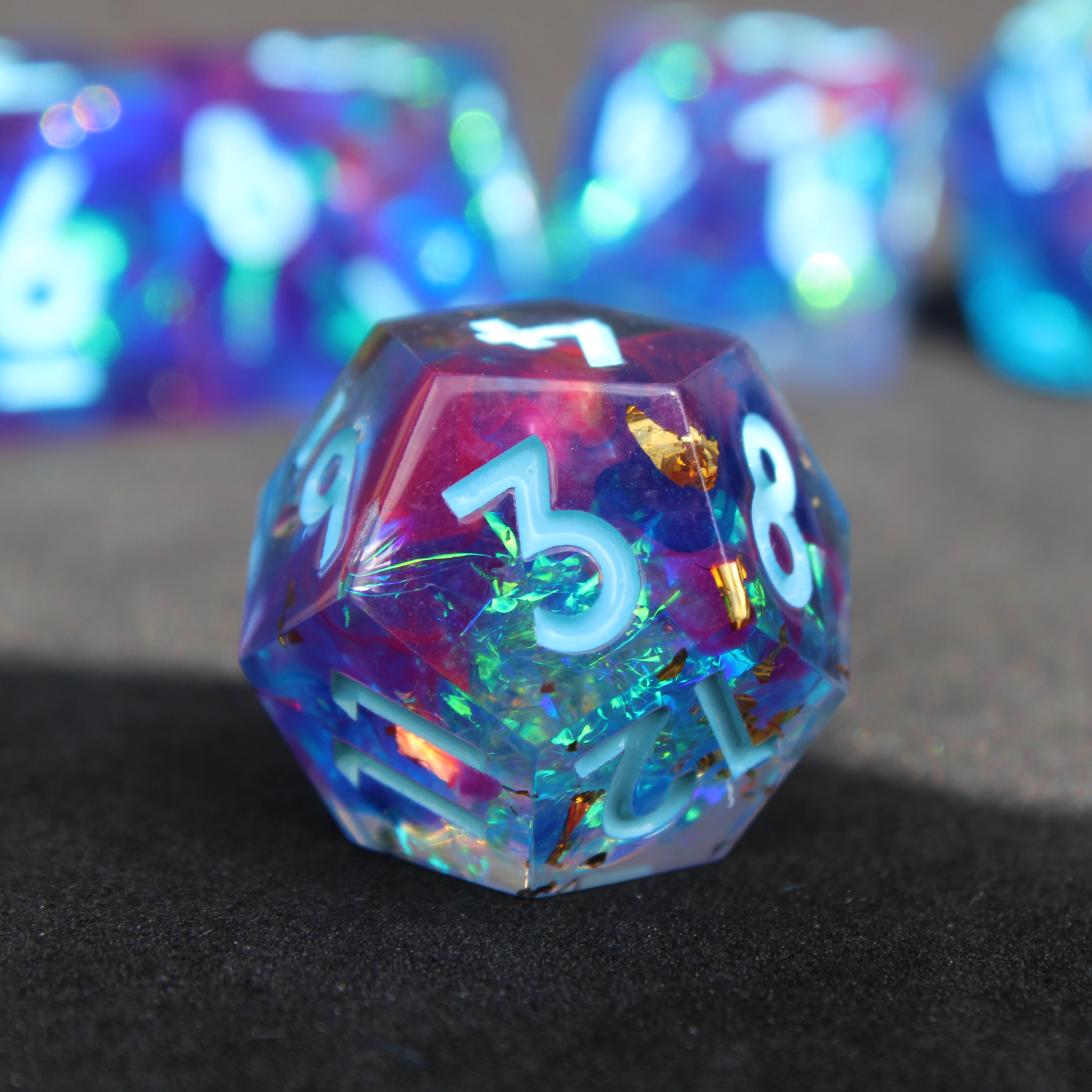 Purple and blue sharp edge dnd dice set. The dice set is used for playing TTRPGs like Dungeons & Dragons / D&D and Pathfinder.