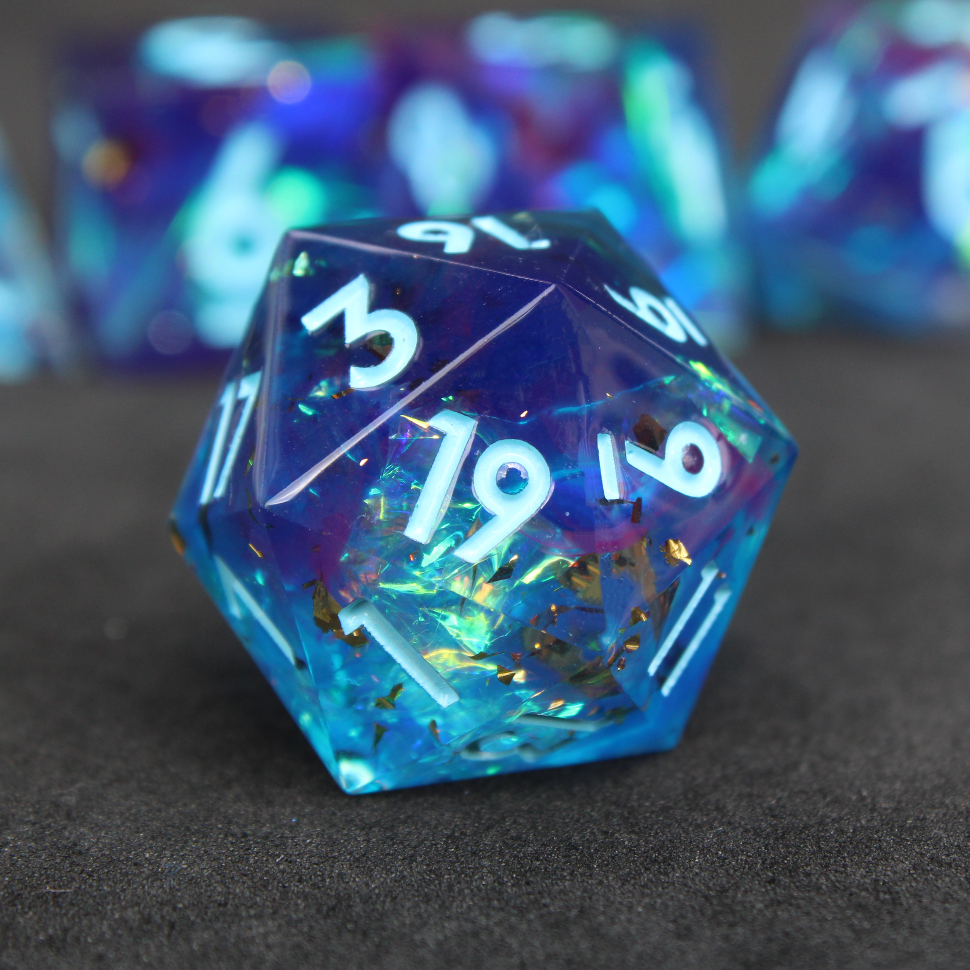 Purple and blue sharp edge dnd dice set. The dice set is used for playing TTRPGs like Dungeons & Dragons / D&D and Pathfinder.