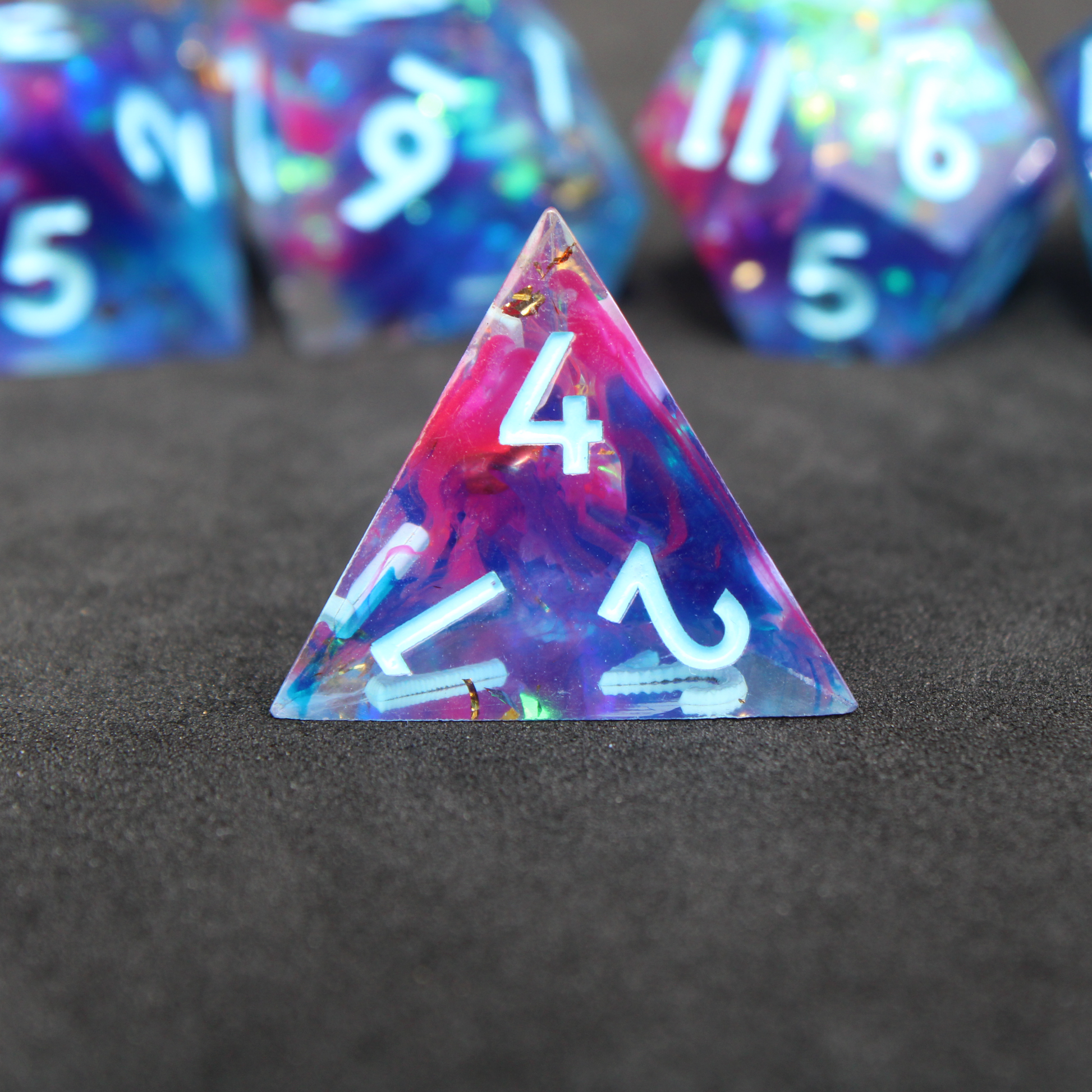 Purple and blue sharp edge dnd dice set. The dice set is used for playing TTRPGs like Dungeons & Dragons / D&D and Pathfinder.