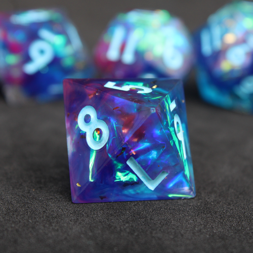 Purple and blue sharp edge dnd dice set. The dice set is used for playing TTRPGs like Dungeons & Dragons / D&D and Pathfinder.