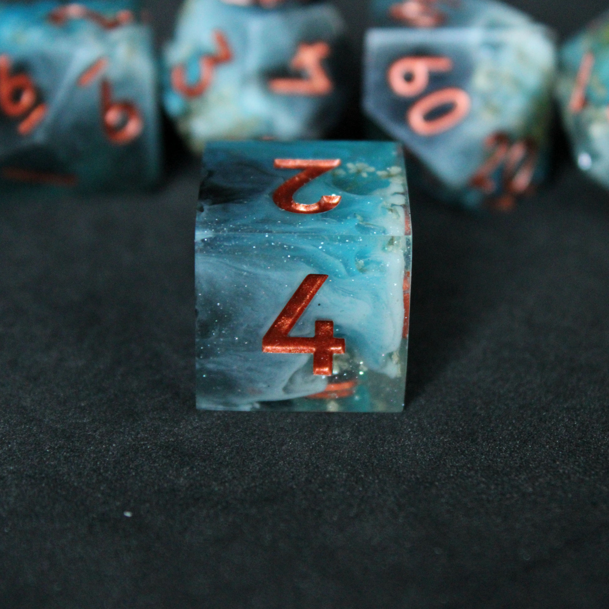 Blue sharp edge D6 dice with white flowers inside. Used in tabletop roleplaying games like Dungeons & Dragons, DND, D&D, Pathfinder.