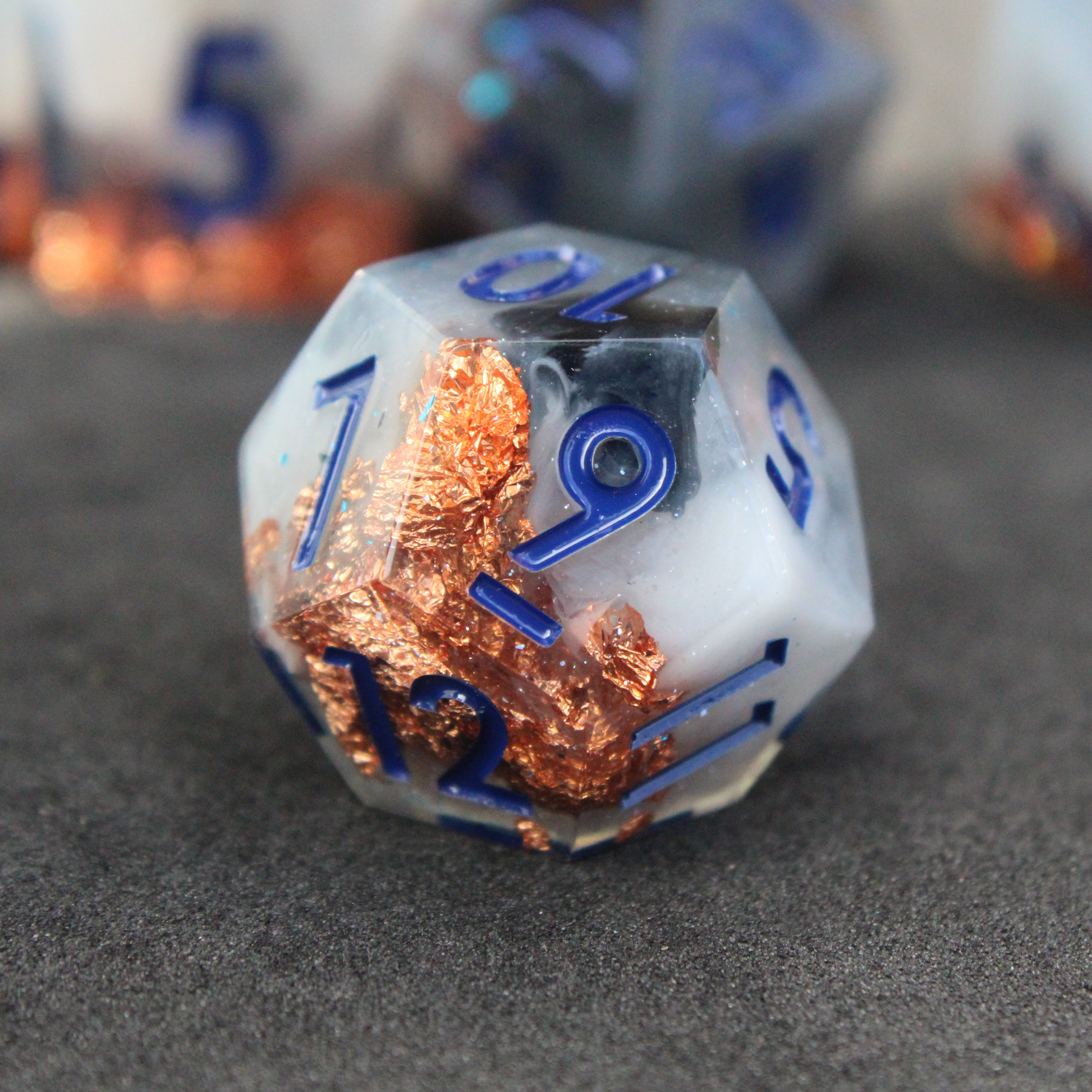 Blue grey sharp edge dnd dice used for playing tabletop roleplaying games like Dungeons & Dragons / D&D and Pathfinder. 