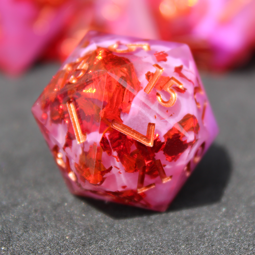 Purple pink and red sharp edge dnd dice. These polyhedral dice are used to play TTRPGs like Dungeons & Dragons / D&D and Pathfinder.