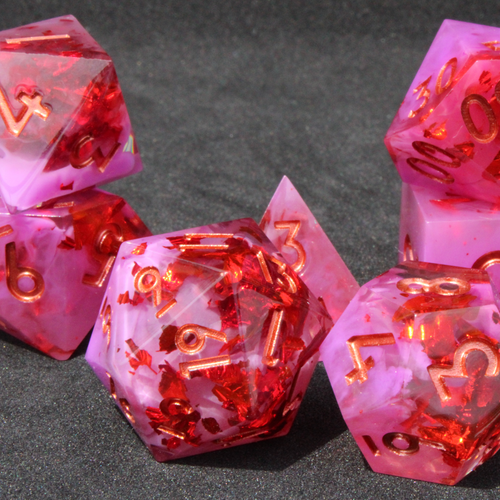 Purple pink and red sharp edge dnd dice. These polyhedral dice are used to play TTRPGs like Dungeons & Dragons / D&D and Pathfinder.