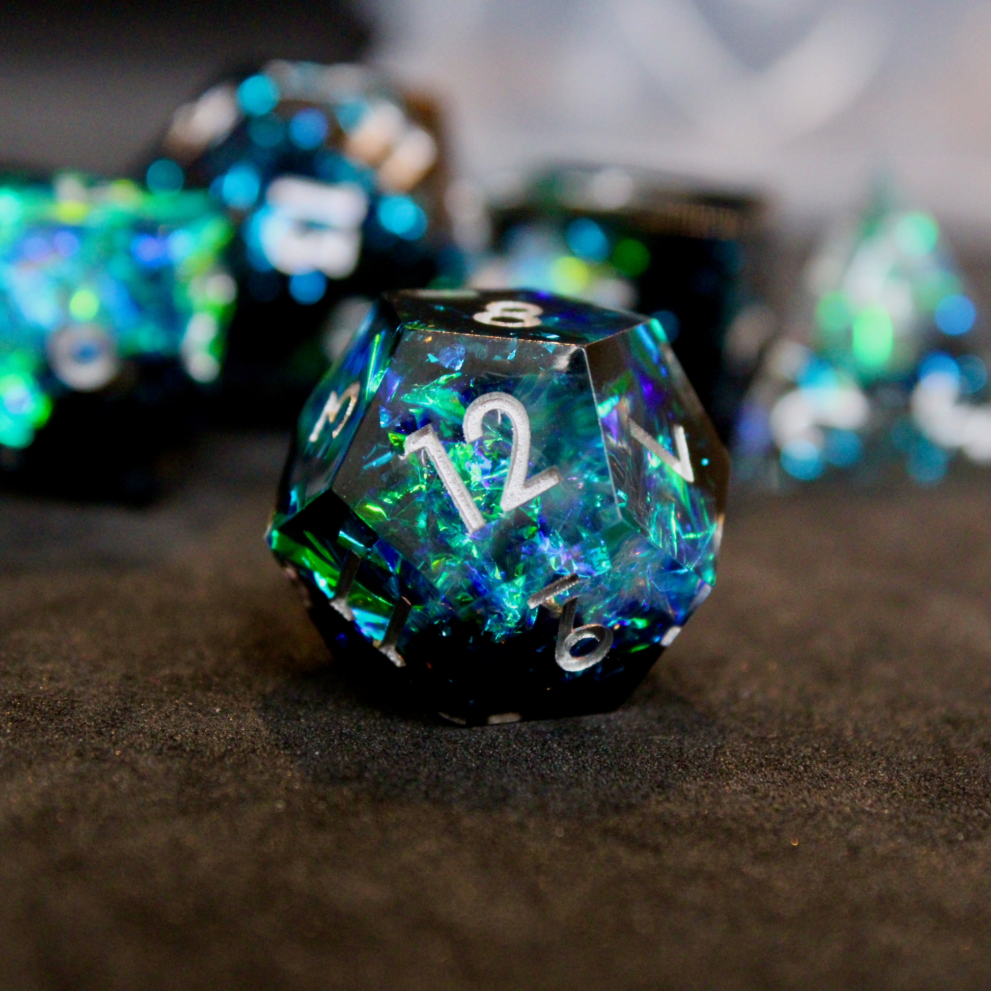 Black and blue sharp edge dnd dice set made of resin and made to look like lightning in a bottle. These polyhedral dice are used to play TTRPGs like Dungeons & Dragons / D&D and Pathfinder.