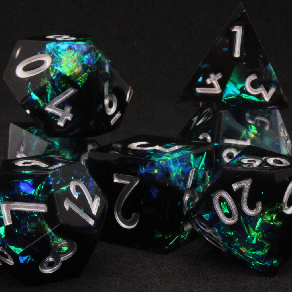 Black and blue sharp edge dnd dice set made of resin and made to look like lightning in a bottle. These polyhedral dice are used to play TTRPGs like Dungeons & Dragons / D&D and Pathfinder.