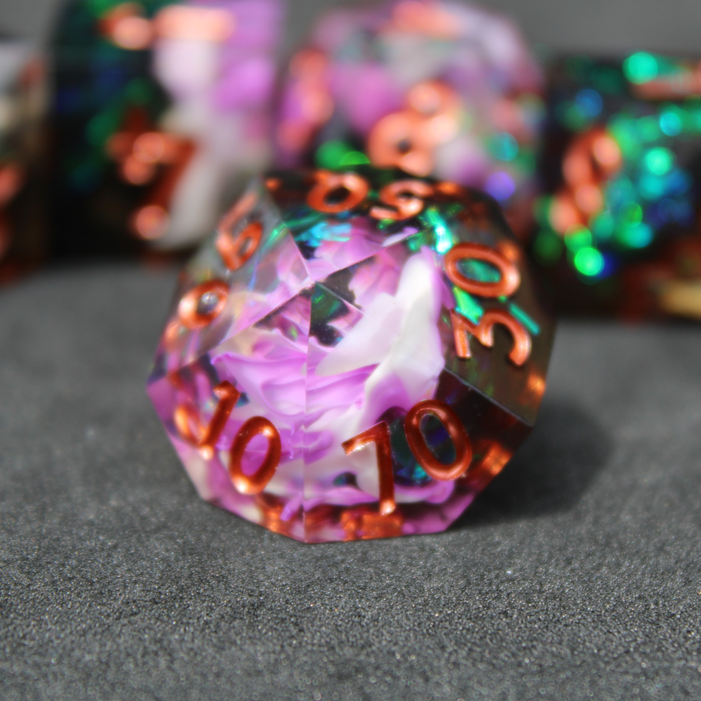 Purple and black resin dnd sharp edge dice. These polyhedral dice are used to play TTRPGs like Dungeons & Dragons / D&D and Pathfinder.