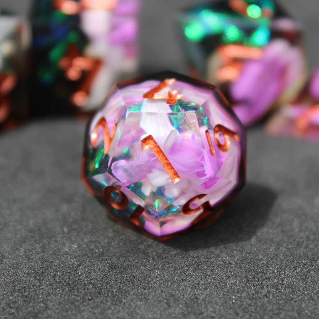 Purple and black resin dnd sharp edge dice. These polyhedral dice are used to play TTRPGs like Dungeons & Dragons / D&D and Pathfinder.