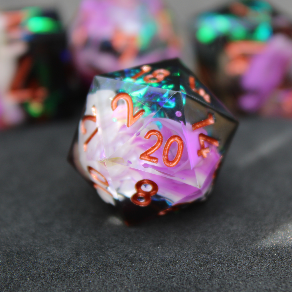 Purple and black resin dnd sharp edge dice. These polyhedral dice are used to play TTRPGs like Dungeons & Dragons / D&D and Pathfinder.