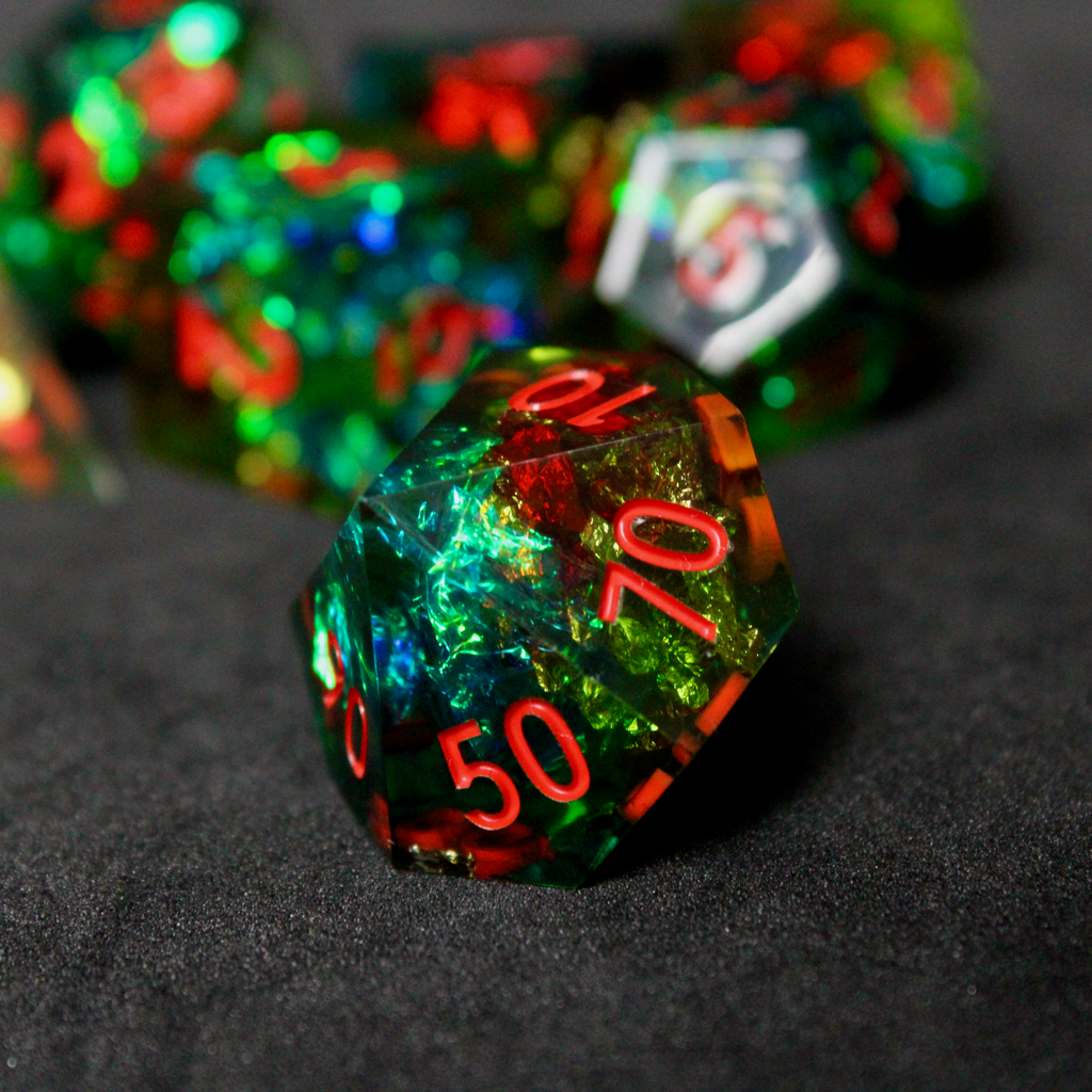 Green resin DND dice with red and blue holographic foils. These polyhedral dice are used in TTRPGs like Dungeons & Dragons / D&D and Pathfinder.