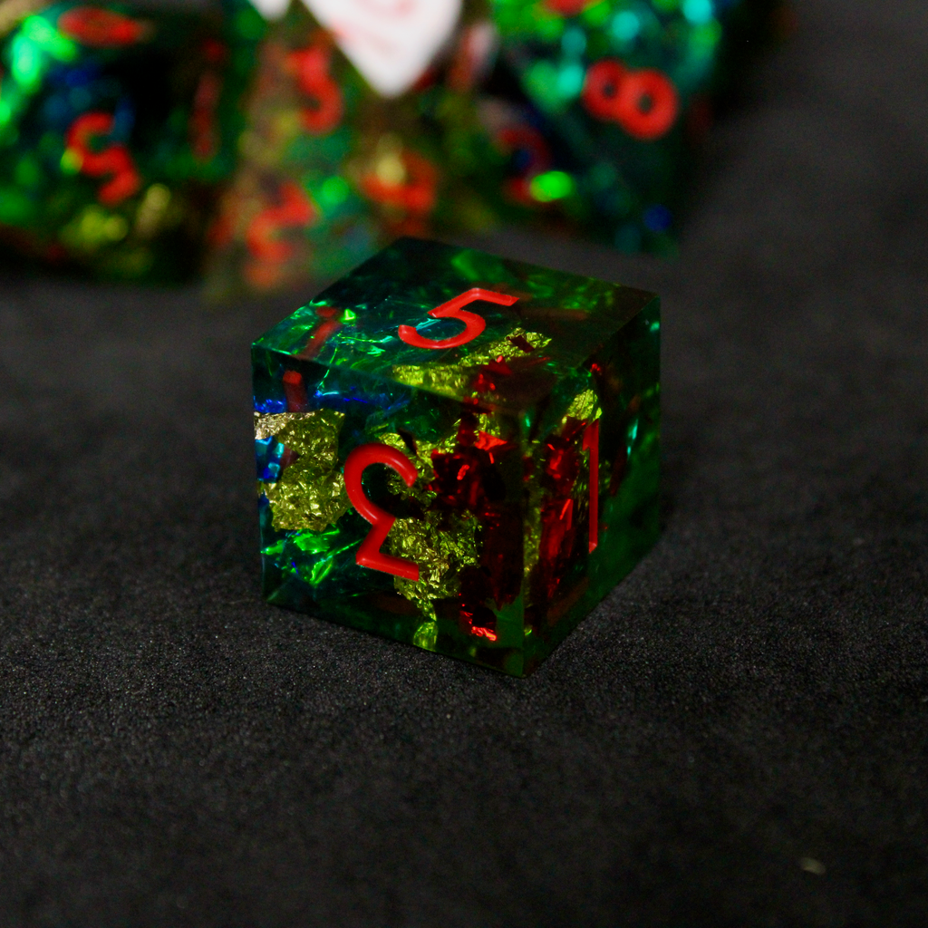 Green resin DND dice with red and blue holographic foils. These polyhedral dice are used in TTRPGs like Dungeons & Dragons / D&D and Pathfinder.